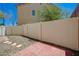Private backyard featuring gravel, pavers, stone steps and white fencing at 7249 Linaria Rd, Las Vegas, NV 89113