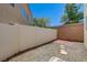 Private backyard featuring gravel, pavers, and stone steps next to a brick wall at 7249 Linaria Rd, Las Vegas, NV 89113