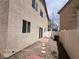 Low maintenance backyard with rock landscaping, a small patio, and a partial fence at 7249 Linaria Rd, Las Vegas, NV 89113