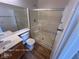 Bathroom featuring tile flooring, a glass-enclosed shower, and a single sink vanity at 7249 Linaria Rd, Las Vegas, NV 89113