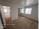 Bedroom featuring neutral carpet, natural light, and mirrored closet doors at 7249 Linaria Rd, Las Vegas, NV 89113