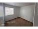 Bright bedroom with a large window allowing natural light, complemented by neutral walls and carpet at 7249 Linaria Rd, Las Vegas, NV 89113