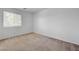 Bedroom featuring a window and neutral carpeting at 7249 Linaria Rd, Las Vegas, NV 89113