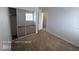A bedroom featuring neutral carpet and mirrored closet doors at 7249 Linaria Rd, Las Vegas, NV 89113