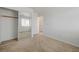 Neutral bedroom with a mirrored closet and standard trim, window and baseboard at 7249 Linaria Rd, Las Vegas, NV 89113