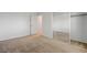 Bedroom with sliding closet doors and neutral carpeting at 7249 Linaria Rd, Las Vegas, NV 89113