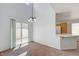 Bright dining area featuring a sliding glass door and a breakfast bar with a kitchen view at 7249 Linaria Rd, Las Vegas, NV 89113