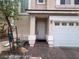 Inviting entryway featuring a brick walkway and a white front door at 7249 Linaria Rd, Las Vegas, NV 89113