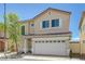 Charming two-story home with a two car garage and a cozy front yard at 7249 Linaria Rd, Las Vegas, NV 89113