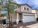 Charming two-story home with a two-car garage and a well-maintained front yard at 7249 Linaria Rd, Las Vegas, NV 89113