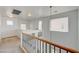 Large second floor landing with windows and decorative wrought iron railing at 7249 Linaria Rd, Las Vegas, NV 89113