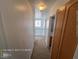 Upstairs hallway featuring carpet, wood cabinets and an open view of downstairs at 7249 Linaria Rd, Las Vegas, NV 89113