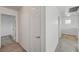 Hallway view with neutral walls and carpet, leading to other rooms at 7249 Linaria Rd, Las Vegas, NV 89113