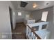 Hallway with carpet, neutral walls and banister leading to bedrooms with natural light at 7249 Linaria Rd, Las Vegas, NV 89113