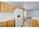 Bright kitchen features wooden cabinets, white appliances, and ample counter space at 7249 Linaria Rd, Las Vegas, NV 89113