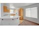 Kitchen with wooden cabinets, white countertops, and stainless steel appliances with a window view at 7249 Linaria Rd, Las Vegas, NV 89113