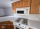 Corner view of the kitchen with white appliances, gas range, and ample counter space at 7249 Linaria Rd, Las Vegas, NV 89113