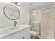 Modern bathroom with granite countertops and a glass-enclosed shower at 7566 Glowing Ember Ct # 101, Las Vegas, NV 89130
