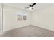 Bright bedroom featuring modern ceiling fan and sleek, light wood flooring at 7566 Glowing Ember Ct # 101, Las Vegas, NV 89130