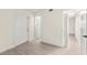 Bright bedroom featuring an entry door and a doorway to another room at 7566 Glowing Ember Ct # 101, Las Vegas, NV 89130