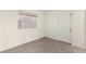 Neutral bedroom with a window and sleek, light wood flooring at 7566 Glowing Ember Ct # 101, Las Vegas, NV 89130