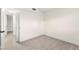 Neutral bedroom featuring sleek flooring and a doorway to another room at 7566 Glowing Ember Ct # 101, Las Vegas, NV 89130