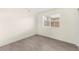 Neutral bedroom with a window and sleek, light wood flooring at 7566 Glowing Ember Ct # 101, Las Vegas, NV 89130