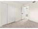 Bedroom with closet and a doorway to another room at 7566 Glowing Ember Ct # 101, Las Vegas, NV 89130