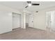 Bright bedroom with a ceiling fan, closet, and an en suite bathroom at 7566 Glowing Ember Ct # 101, Las Vegas, NV 89130