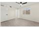 Neutral bedroom featuring modern ceiling fan, a window, and sleek flooring at 7566 Glowing Ember Ct # 101, Las Vegas, NV 89130