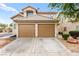 Two-story home featuring a tiled roof and a spacious two-car garage at 7566 Glowing Ember Ct # 101, Las Vegas, NV 89130