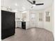 Open layout featuring the kitchen with black appliances and breakfast area at 7566 Glowing Ember Ct # 101, Las Vegas, NV 89130