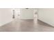Spacious living room with light wood floors and neutral paint throughout at 7566 Glowing Ember Ct # 101, Las Vegas, NV 89130
