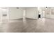Bright living room with modern light wood flooring and neutral walls at 7566 Glowing Ember Ct # 101, Las Vegas, NV 89130