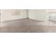 Large living room with light wood flooring and a laundry area at 7566 Glowing Ember Ct # 101, Las Vegas, NV 89130