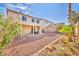 Spacious backyard featuring decorative rock landscaping and a covered patio area at 7886 Palace Monaco Ave, Las Vegas, NV 89117