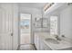 This bathroom featuring large mirror and bright lights is conveniently located near a bedroom for easy access at 7886 Palace Monaco Ave, Las Vegas, NV 89117