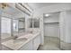 Bright bathroom featuring a double vanity, and walk-in closet at 7886 Palace Monaco Ave, Las Vegas, NV 89117