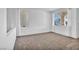 Spacious carpeted bedroom with natural lighting from two large windows and neutral colored walls at 7886 Palace Monaco Ave, Las Vegas, NV 89117