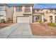 Two-story home featuring a stucco facade, red shutters, and a two car garage at 7886 Palace Monaco Ave, Las Vegas, NV 89117