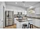 Modern kitchen with island seating, stainless appliances, and granite countertops at 7886 Palace Monaco Ave, Las Vegas, NV 89117