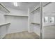 Spacious walk-in closet with shelving and racks, offering ample storage solutions, adjacent to the bedroom at 7886 Palace Monaco Ave, Las Vegas, NV 89117