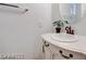 Charming bathroom features round mirror over pedestal sink with decorative accents at 7908 Morning Gallop Ct, Las Vegas, NV 89131