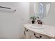 Bathroom featuring single sink vanity with white marble countertop at 7908 Morning Gallop Ct, Las Vegas, NV 89131