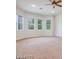 This bedroom is bright and spacious, featuring carpeted floors, a ceiling fan, and large windows at 7908 Morning Gallop Ct, Las Vegas, NV 89131