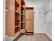 Walk-in closet featuring shelves, cabinets and wire racking for ample storage and organization at 7908 Morning Gallop Ct, Las Vegas, NV 89131