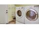 Well-equipped laundry area with new washer, dryer, and shelving for organized storage at 7908 Morning Gallop Ct, Las Vegas, NV 89131