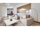 Bright living room featuring neutral furniture, tile floors, and an open layout at 7908 Morning Gallop Ct, Las Vegas, NV 89131