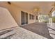 Covered patio with brick flooring, ceiling fan, and sliding glass doors for indoor/outdoor living at 7908 Morning Gallop Ct, Las Vegas, NV 89131