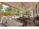 Covered patio, furnished with outdoor seating and grill, for relaxing and entertaining guests at 7908 Morning Gallop Ct, Las Vegas, NV 89131